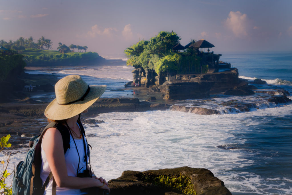 Watching the temple prists start the day at Tanah Lot, Bali.